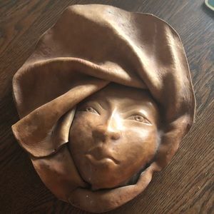 Formed leather face sculpture
